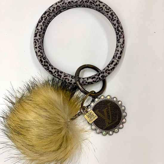 O Ring Keychain in black & white cheetah with puff ball - Patches Of Upcycling