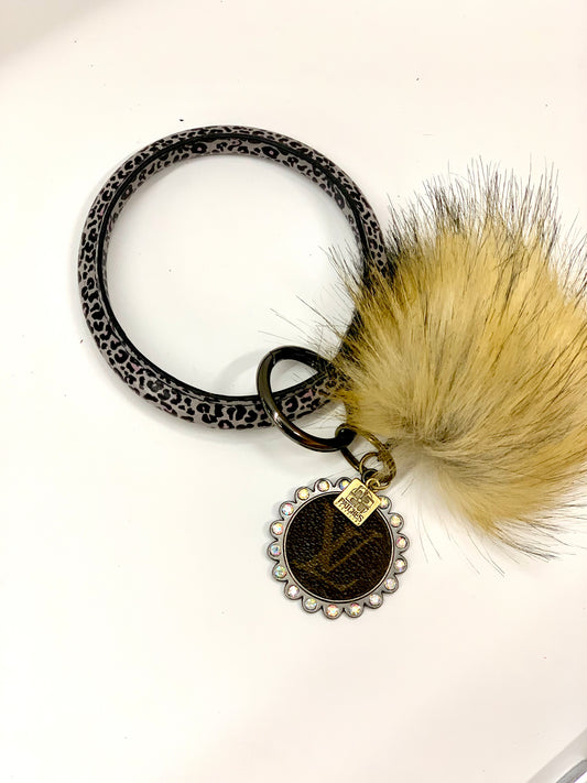 O Ring Keychain in black & white cheetah with puff ball - Patches Of Upcycling