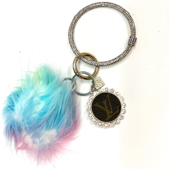 Ring Keychain in black & white cheetah with rainbow puff ball - Patches Of Upcycling