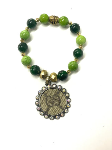 Hand beaded green & gold stretchy bracelet with black 25mm pendant GG - Patches Of Upcycling